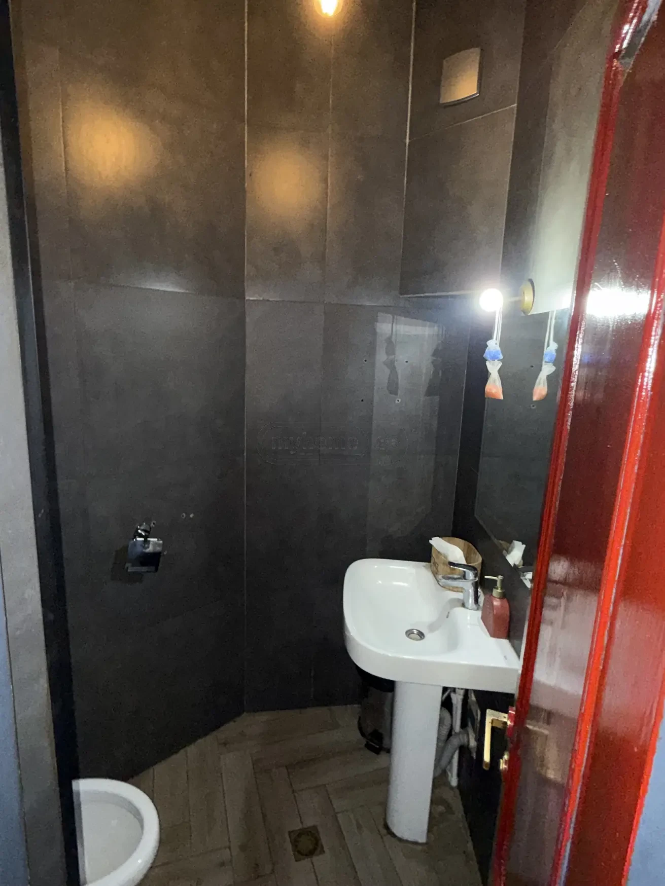 commercial cafe bar space for rent on Aghmashenebeli Avenue 26, Chugureti, Tbilisi — guest WC with dark tiling
