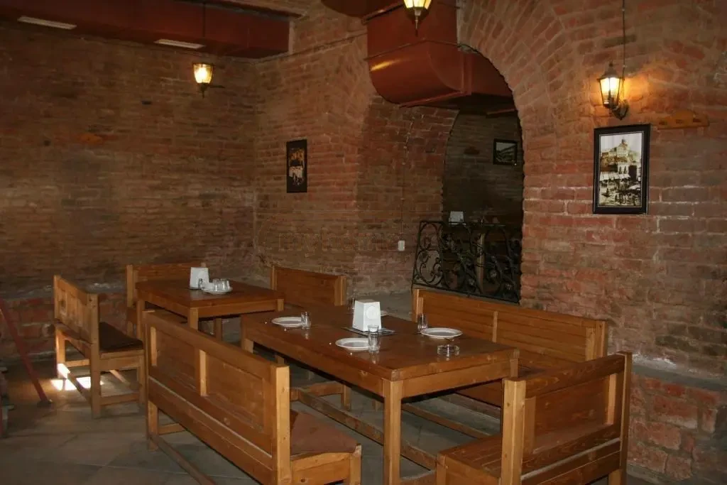 commercial space for rent on Aghmashenebeli Avenue, Chugureti, Tbilisi — main dining hall with set tables and vaulted brick walls