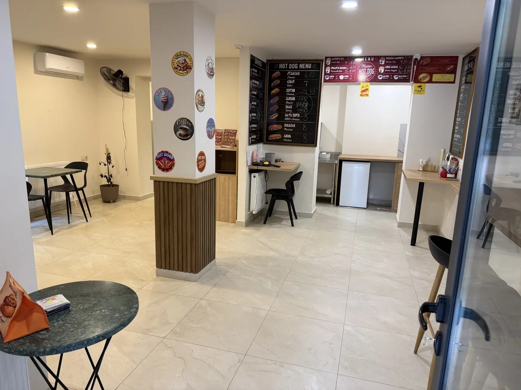 commercial space for rent on Kazbegi Avenue 47b, Saburtalo, Tbilisi — front of house with service counter and menu boards
