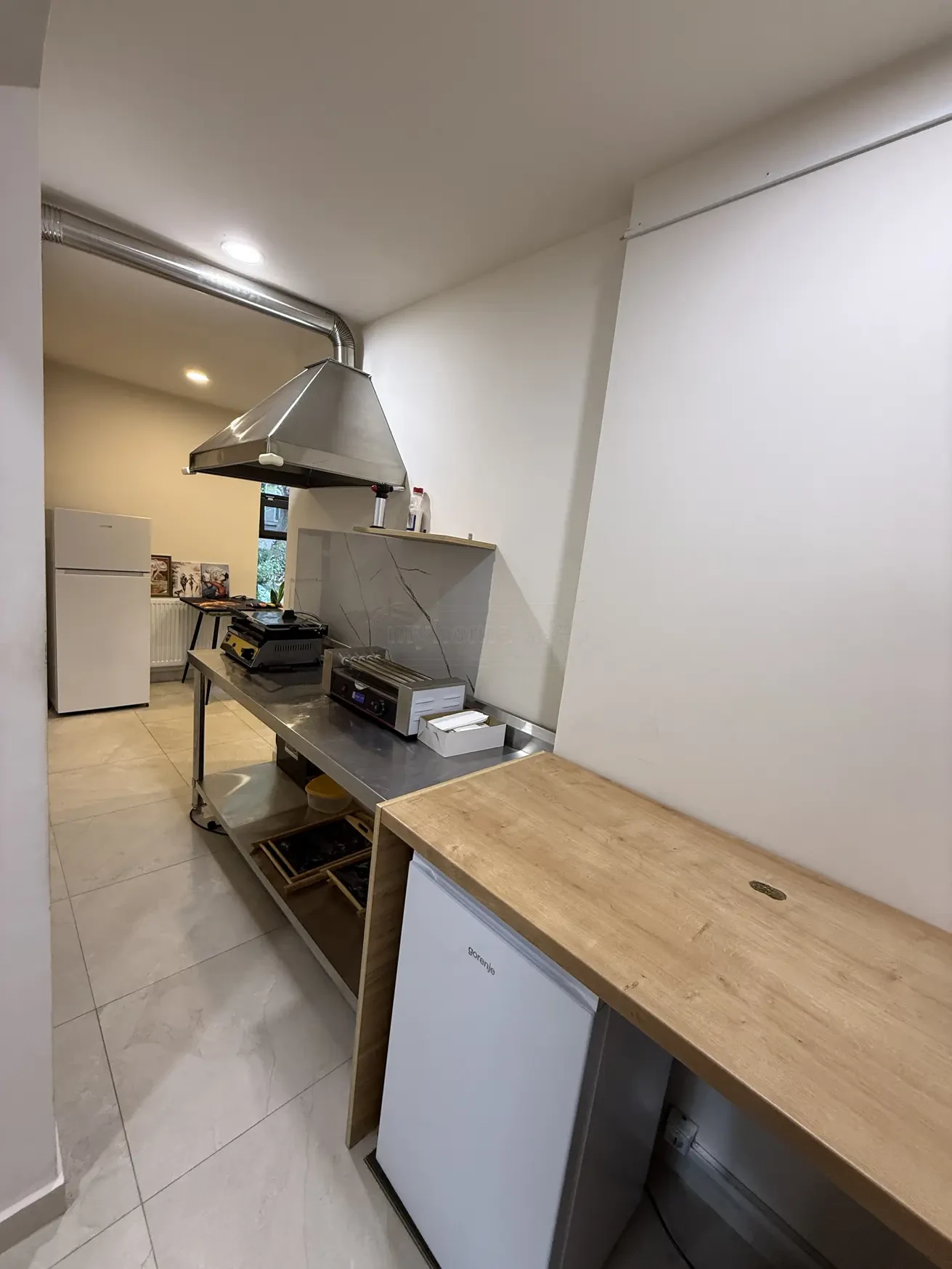 commercial space for rent on Kazbegi Avenue 47b, Saburtalo, Tbilisi — stainless prep kitchen with extractor hood