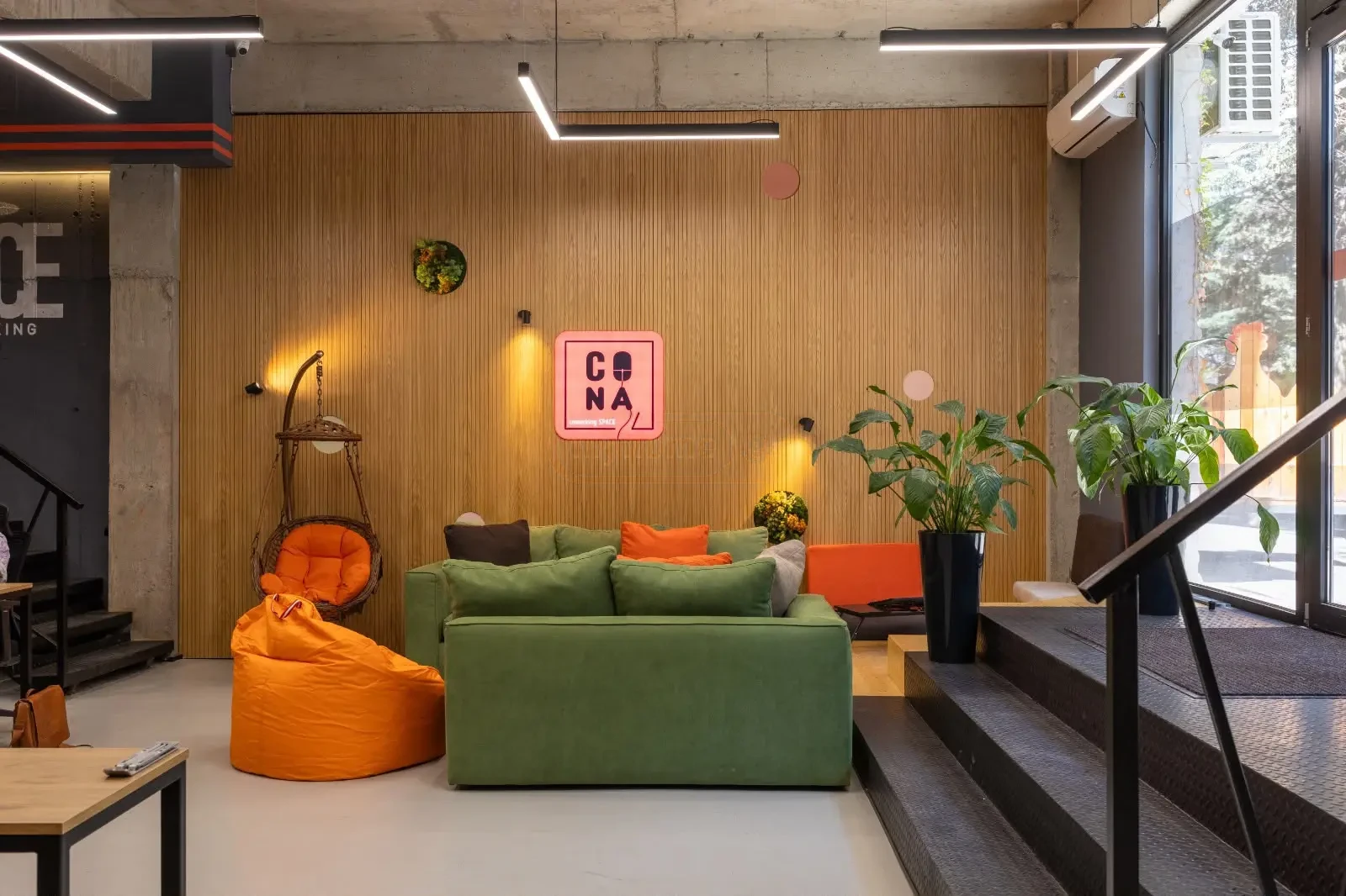 office space for rent on Politkovskaya Street (Jikia), Saburtalo, Tbilisi — lounge zone with wood-panel wall