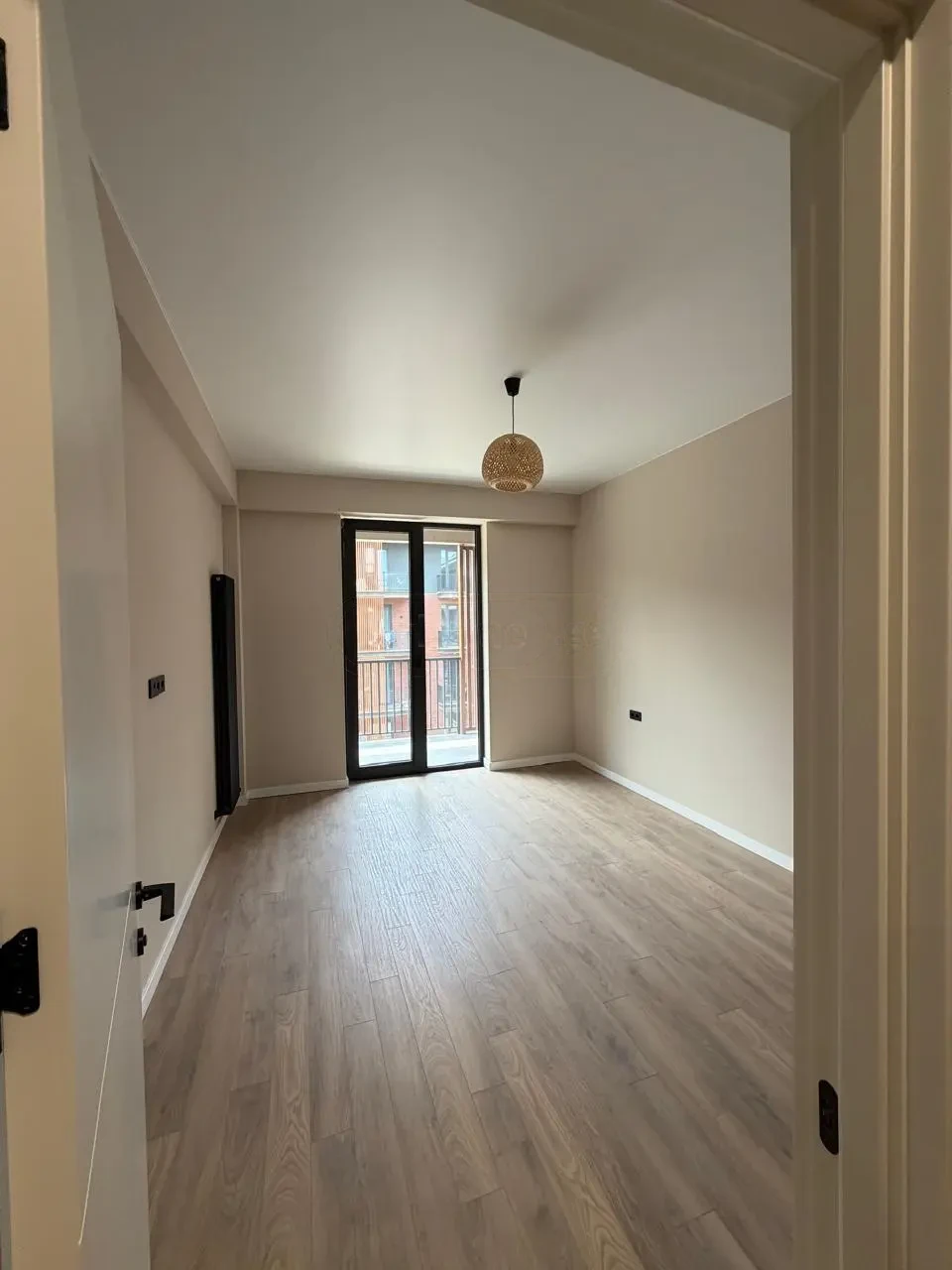 2-room apartment for sale on Permtserta Street, Nutsubidze Plateau, Tbilisi — bedroom with balcony access