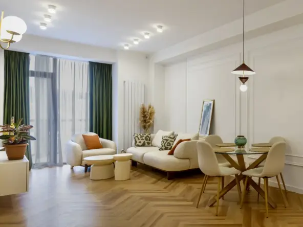 2-room apartment for sale on Politkovskaya Street, Saburtalo, Tbilisi — living room with herringbone parquet and designer furniture