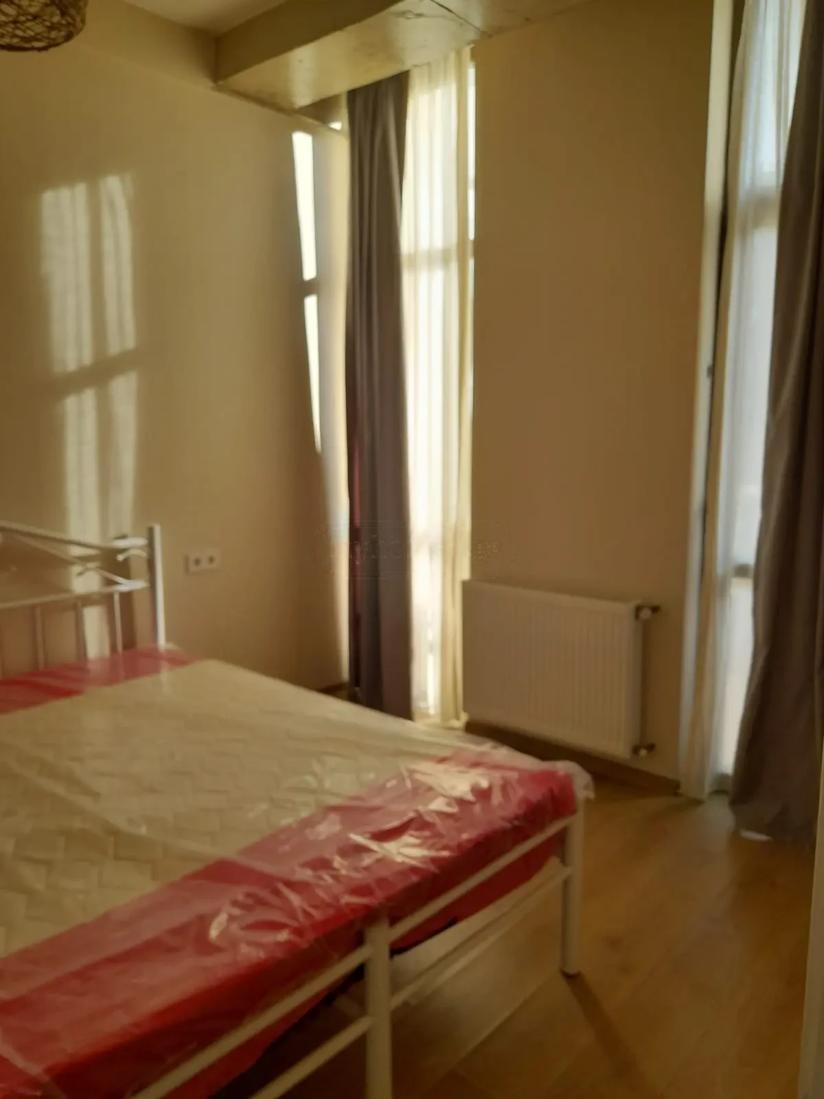 3-room apartment for rent on Tskneti Highway, Bagebi, Tbilisi — bedroom with tall windows