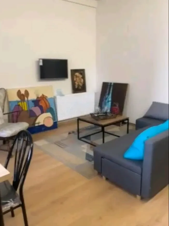 3-room apartment for rent on Tskneti Highway, Bagebi, Tbilisi — living room with TV and sofa