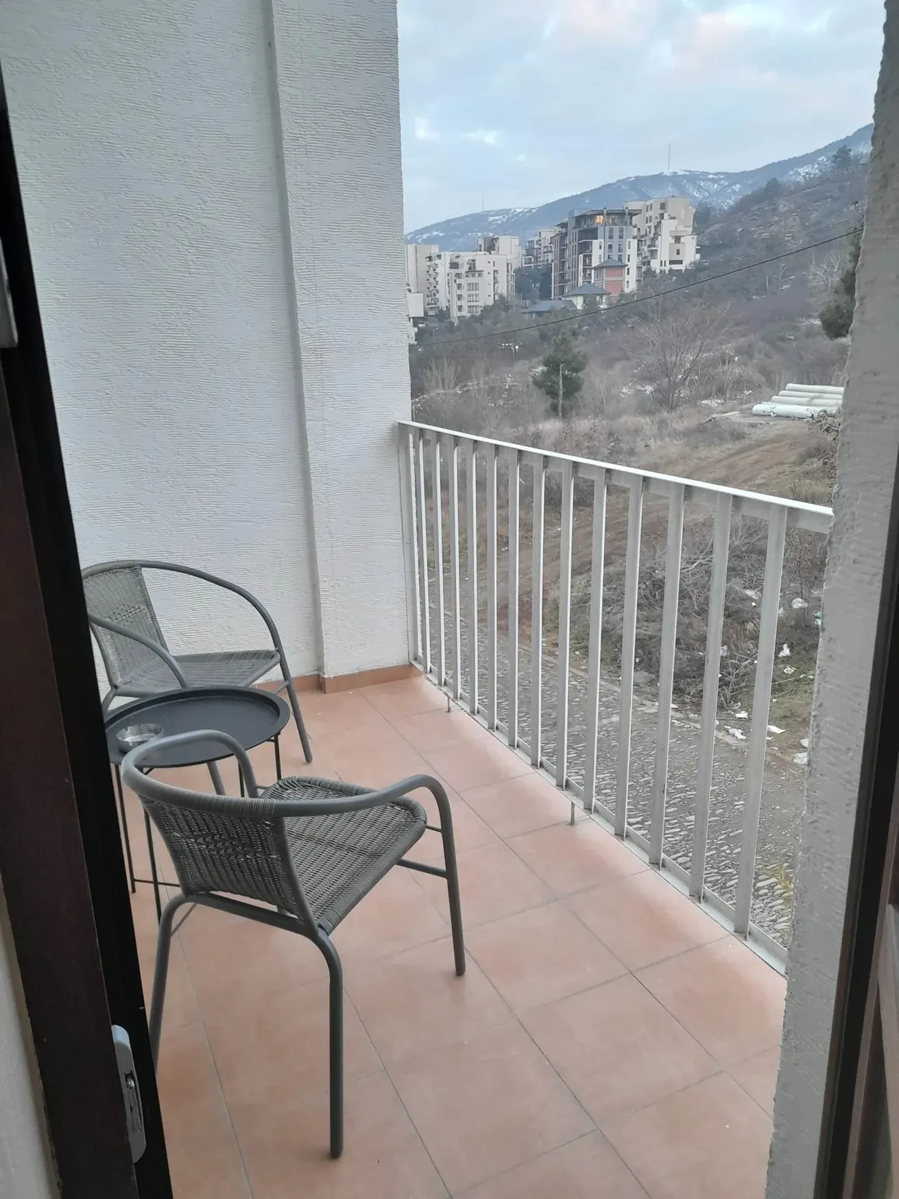 3-room apartment for rent on Tskneti Highway, Bagebi, Tbilisi — balcony with seating and hillside view
