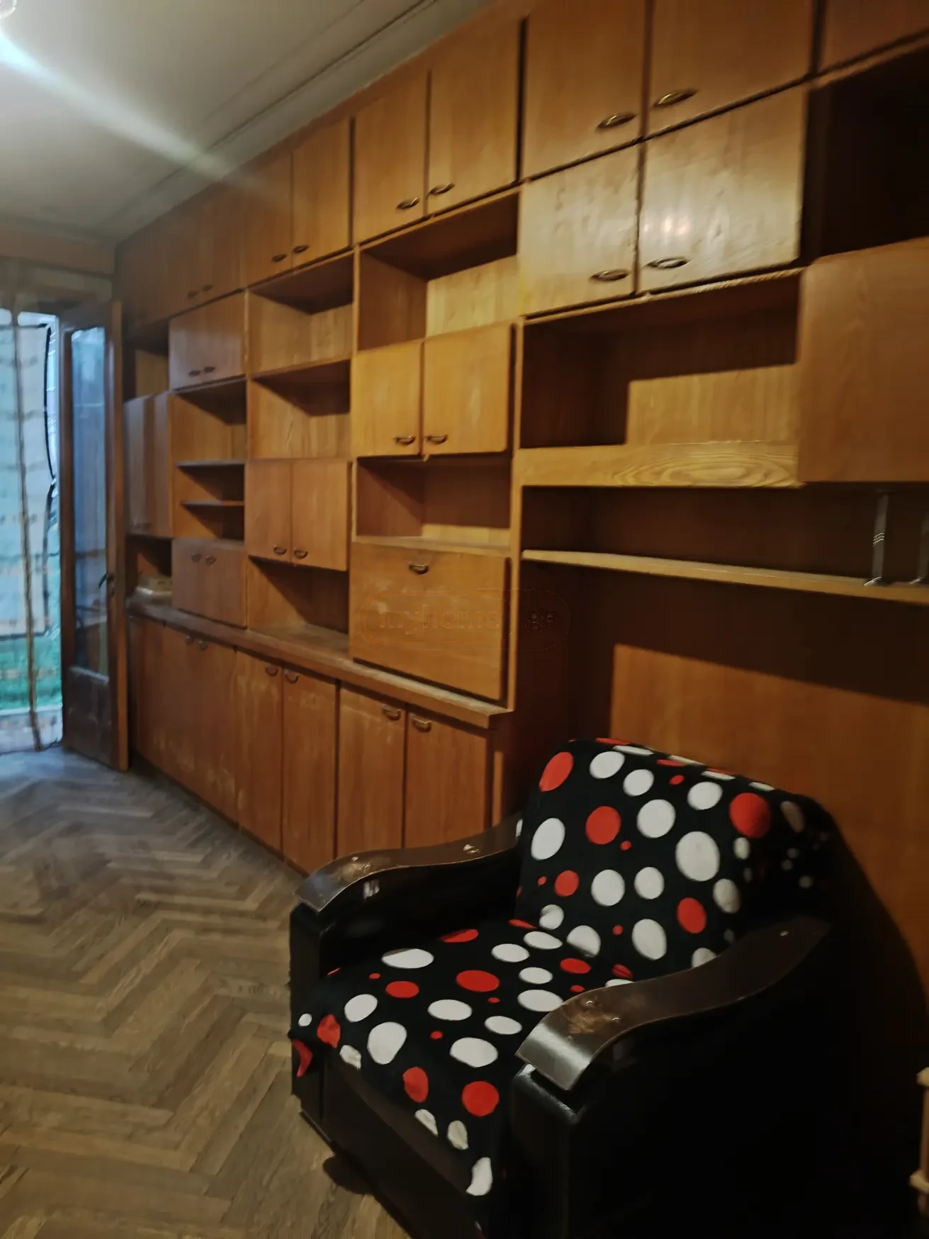 3-room apartment for rent on Tskneti Street, Vake, Tbilisi — wall unit and armchair