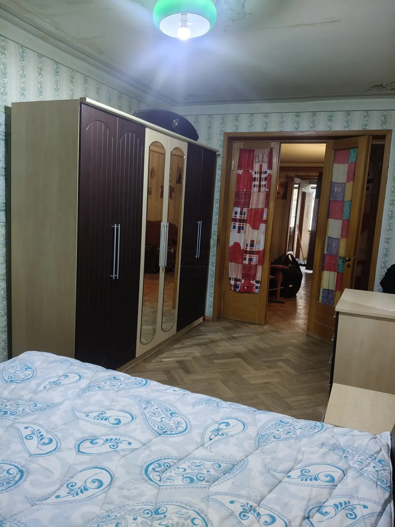3-room apartment for rent on Tskneti Street, Vake, Tbilisi — bedroom with double bed and wardrobe